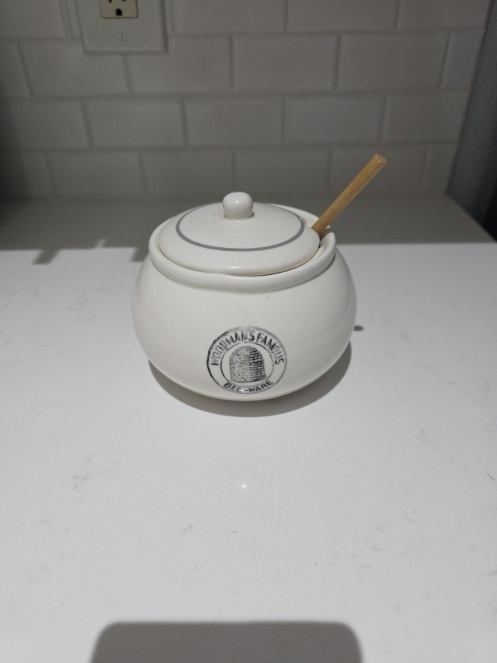 Creative Co-Op Woodmans Famous White Ceramic Jar with Logo Stamp